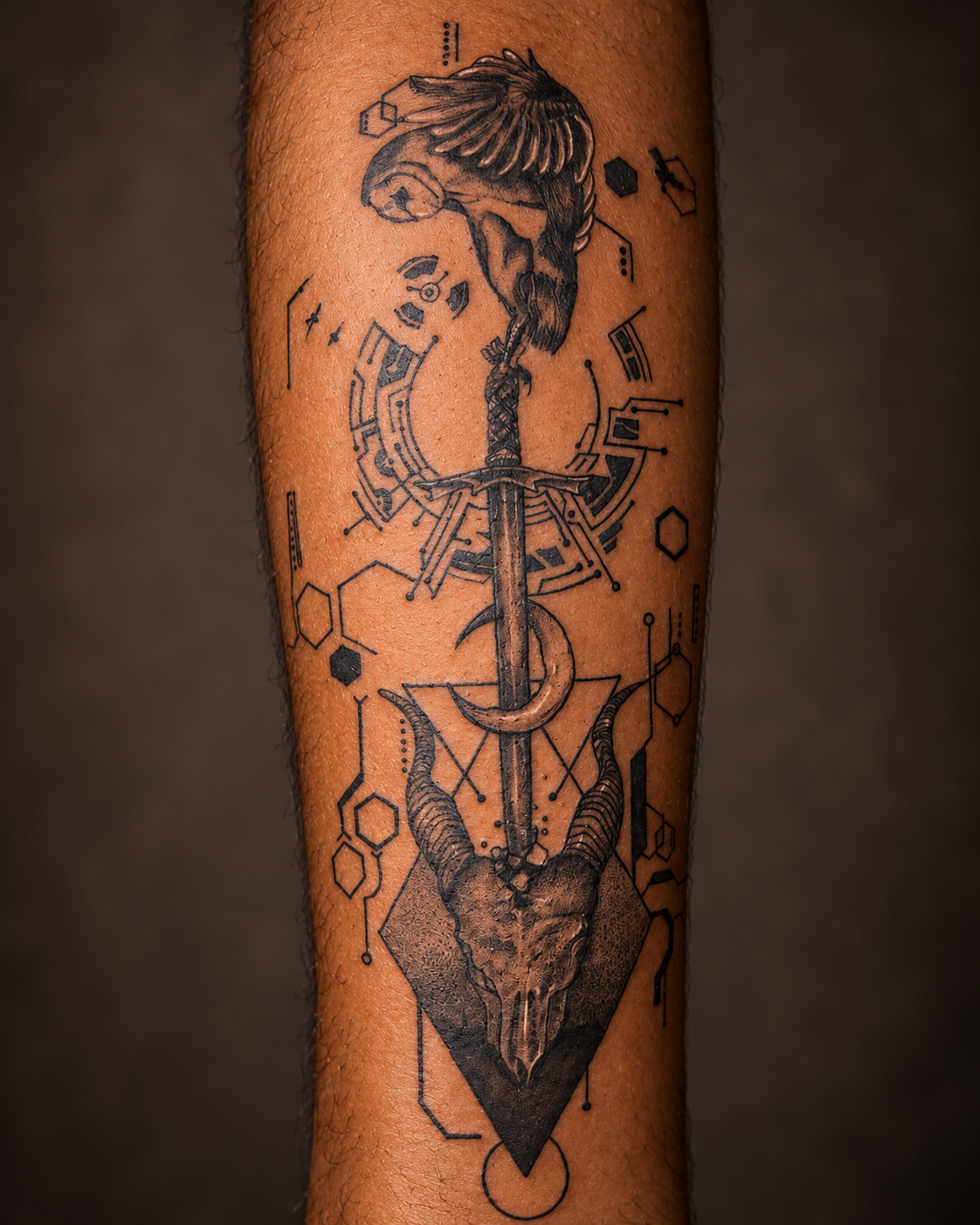 Geometric sword and ram skull tattoo artwork